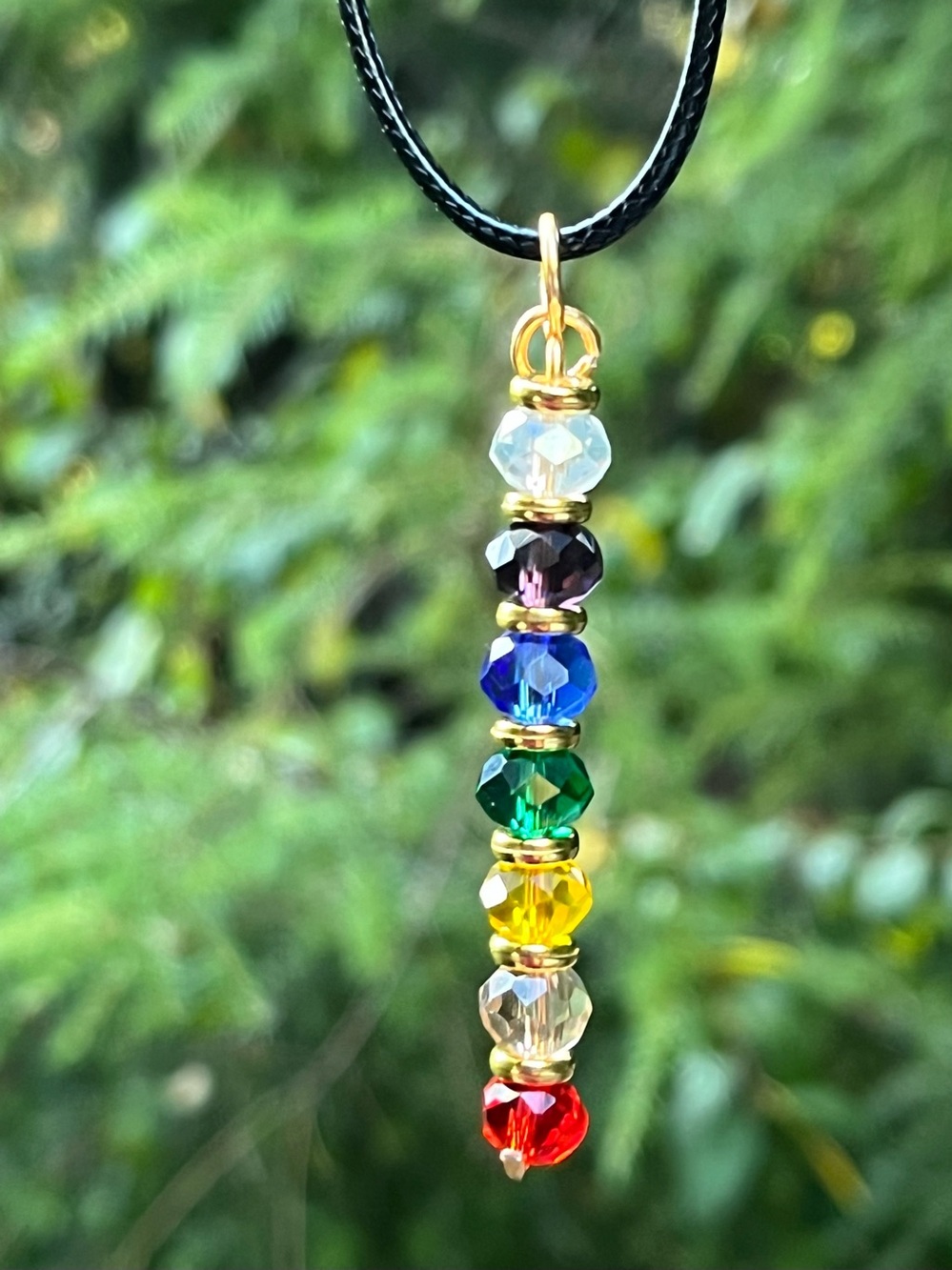 The chakras necklace -Accented Rainbow Crystal Bead Pendant very pretty!!